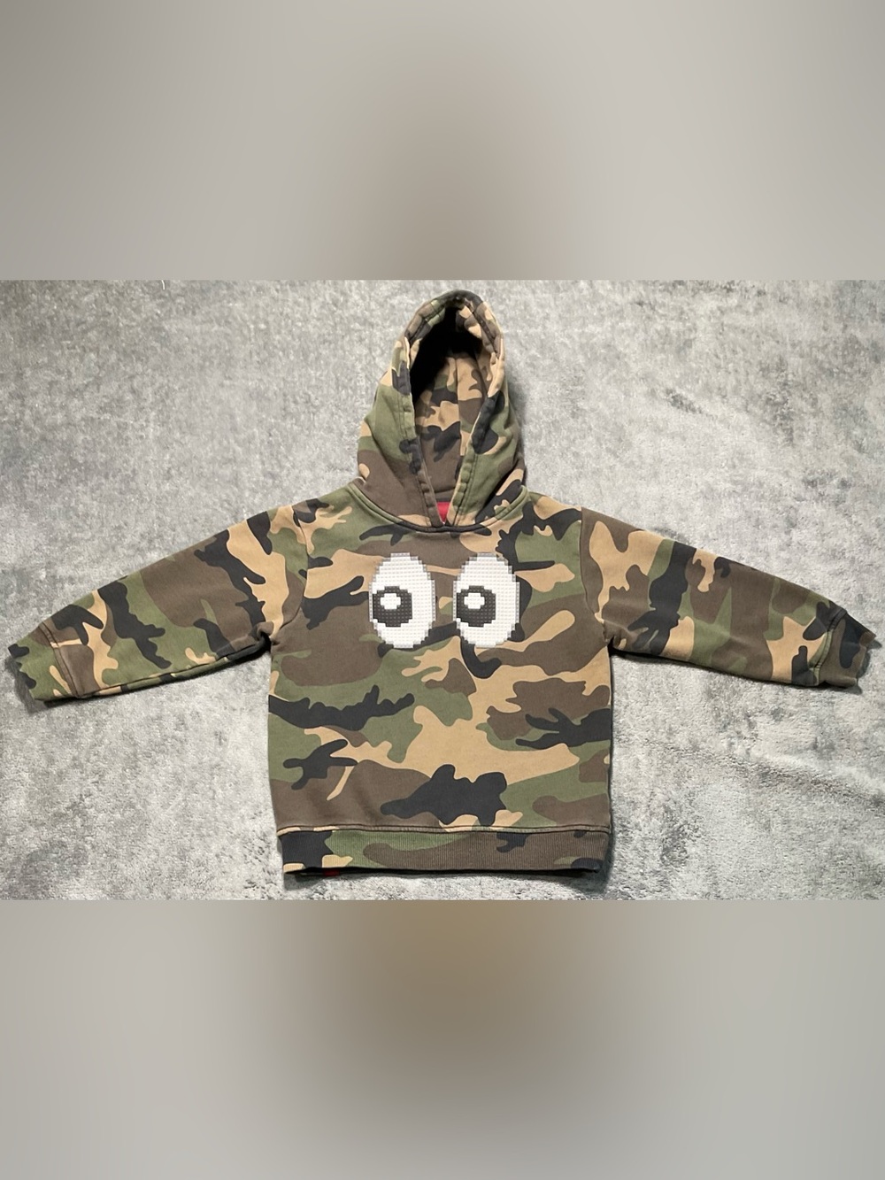 Mostly Heard Rarely Seen Kids Camo Hoodie with Pixel Eyes - Green Brown